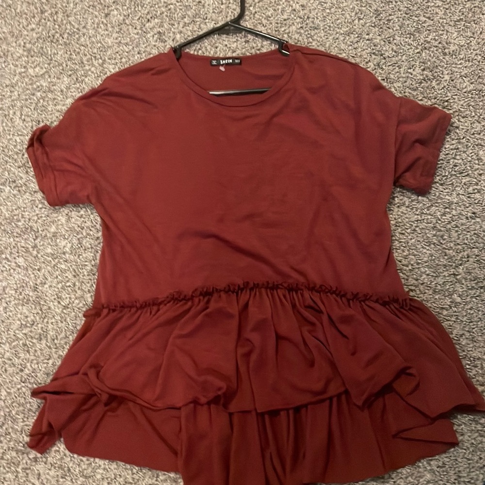 This is a oversized, flowy, deep red SHEIN shirt. Size medium.